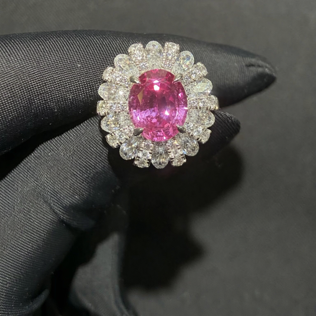 Front view of oval lab-grown Padparadscha floral halo ring for romantic proposals