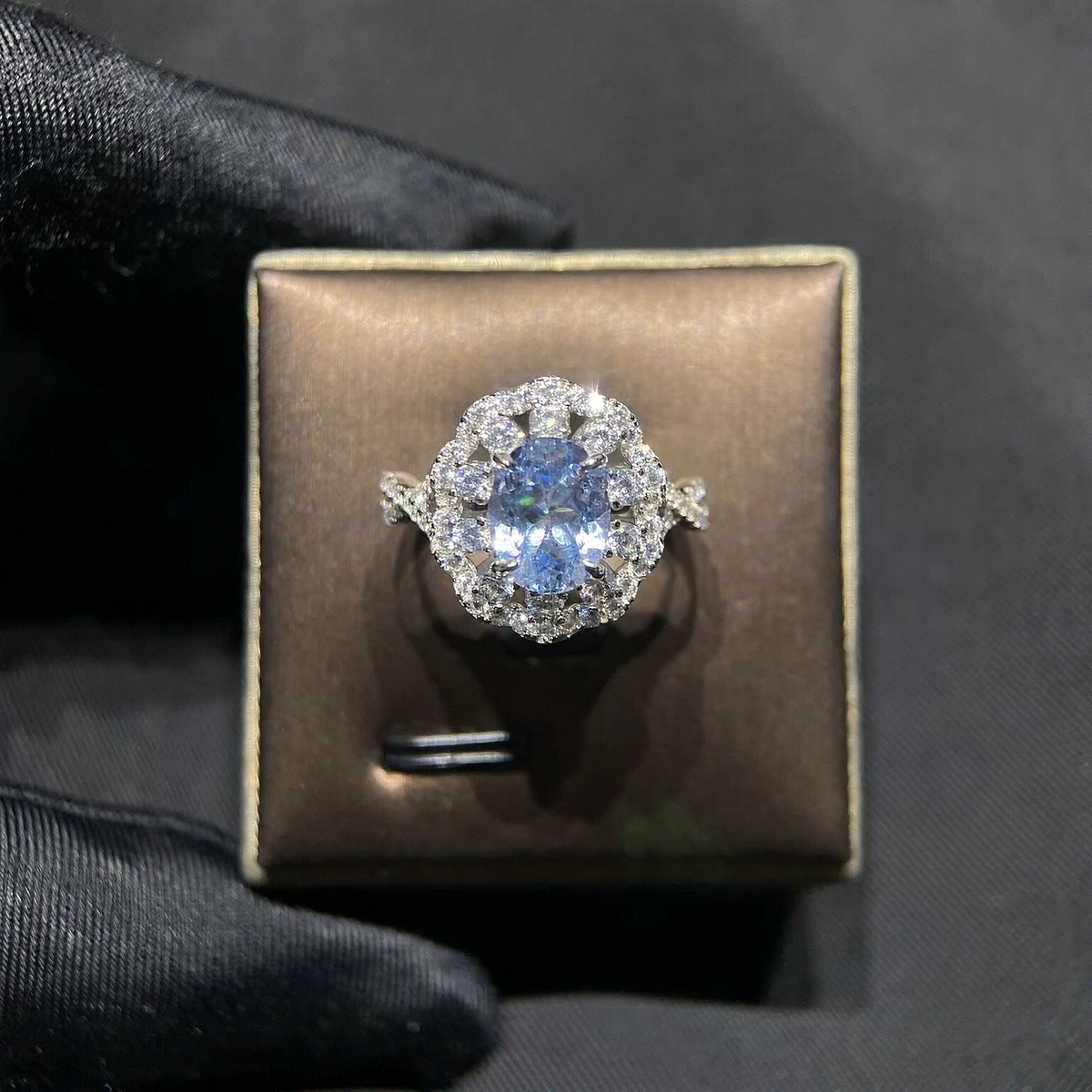 Front view of oval lab-grown aquamarine floral halo ring for engagement celebrations