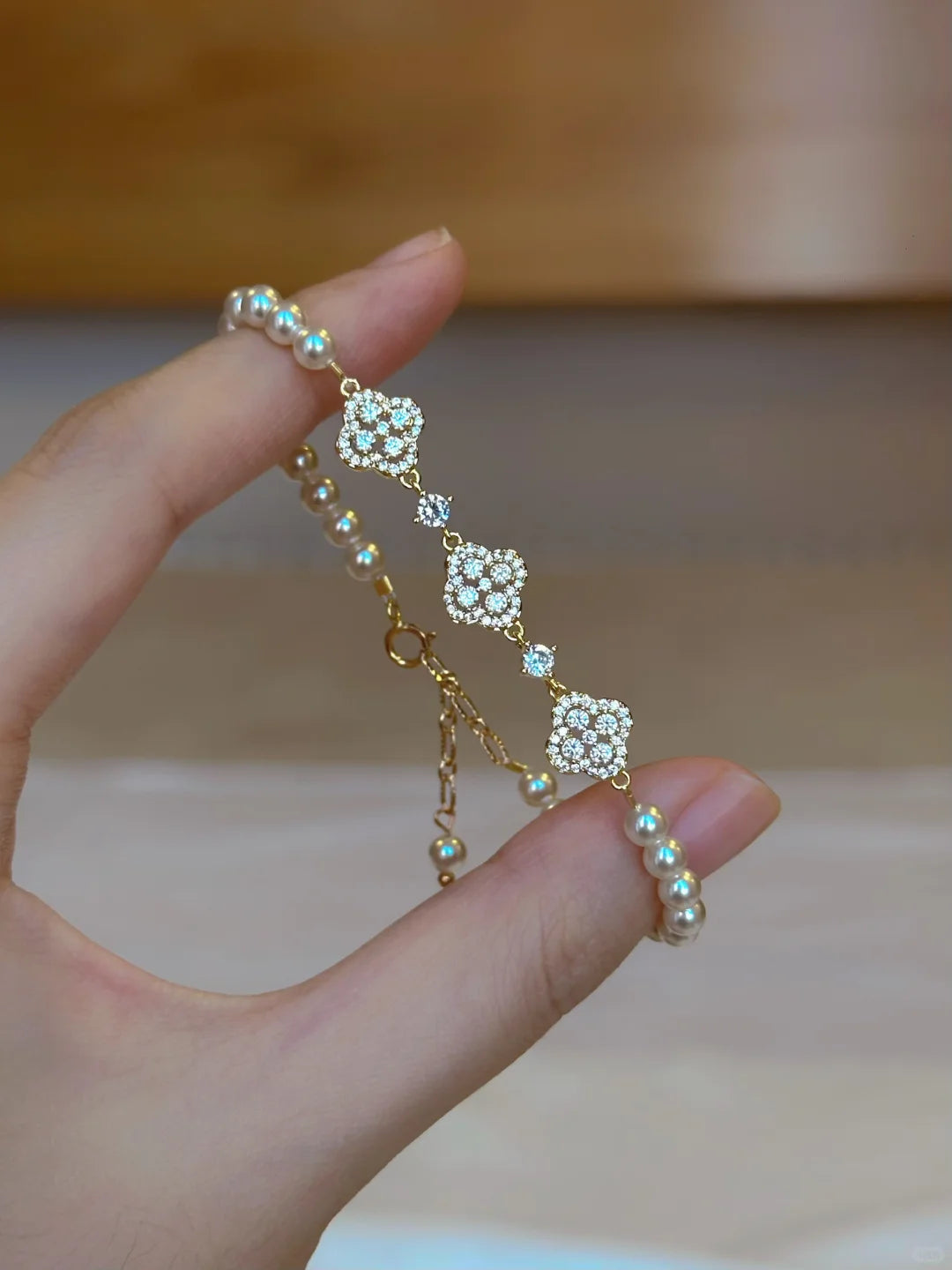 Detail view of flower motif high-lustre freshwater pearl bracelet for bridal styling
