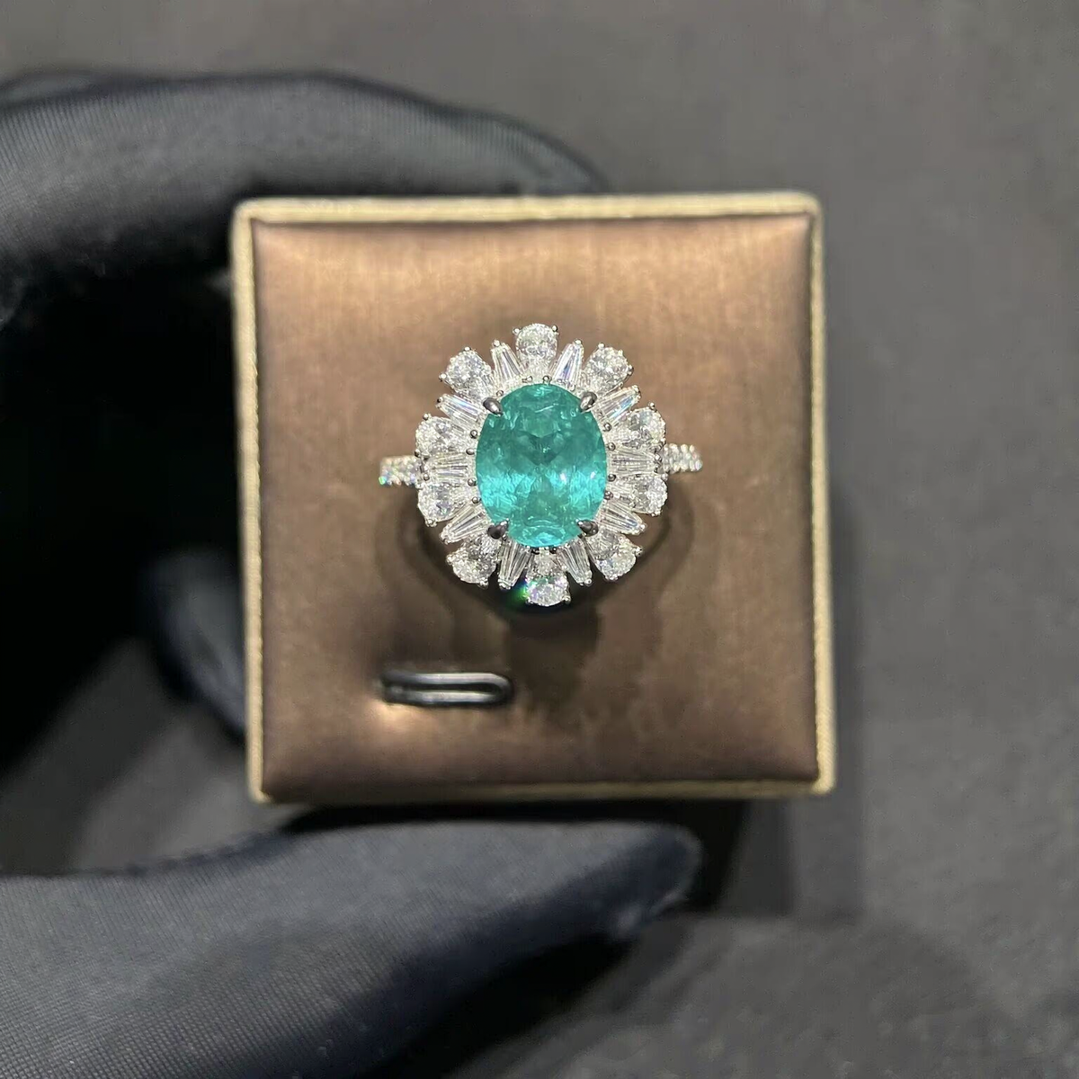 Front view of oval lab-grown Paraiba gemstone marquise halo ring for anniversary gifts