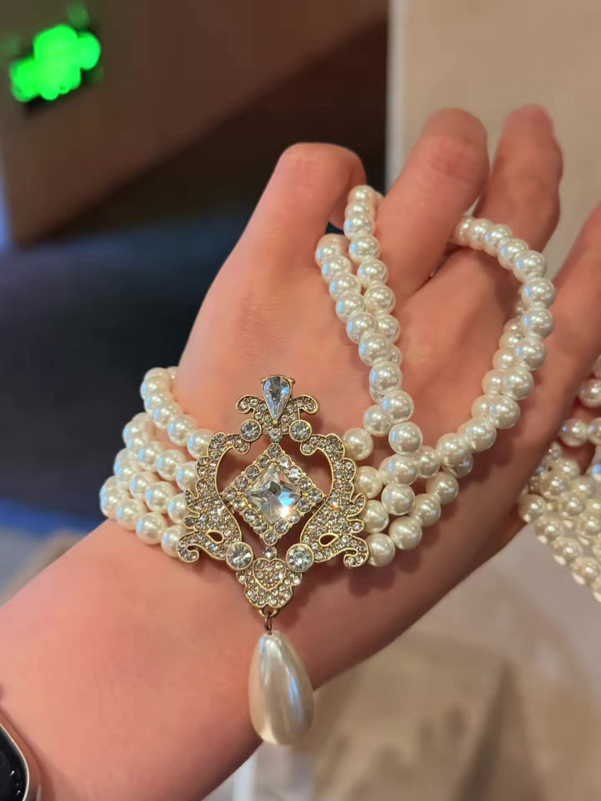 Styled view of baroque drop high-lustre freshwater pearl earrings for wedding guest looks
