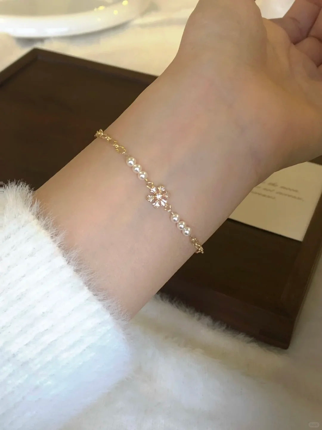 Detail view of pearl station high-lustre freshwater pearl bracelet for bridal styling