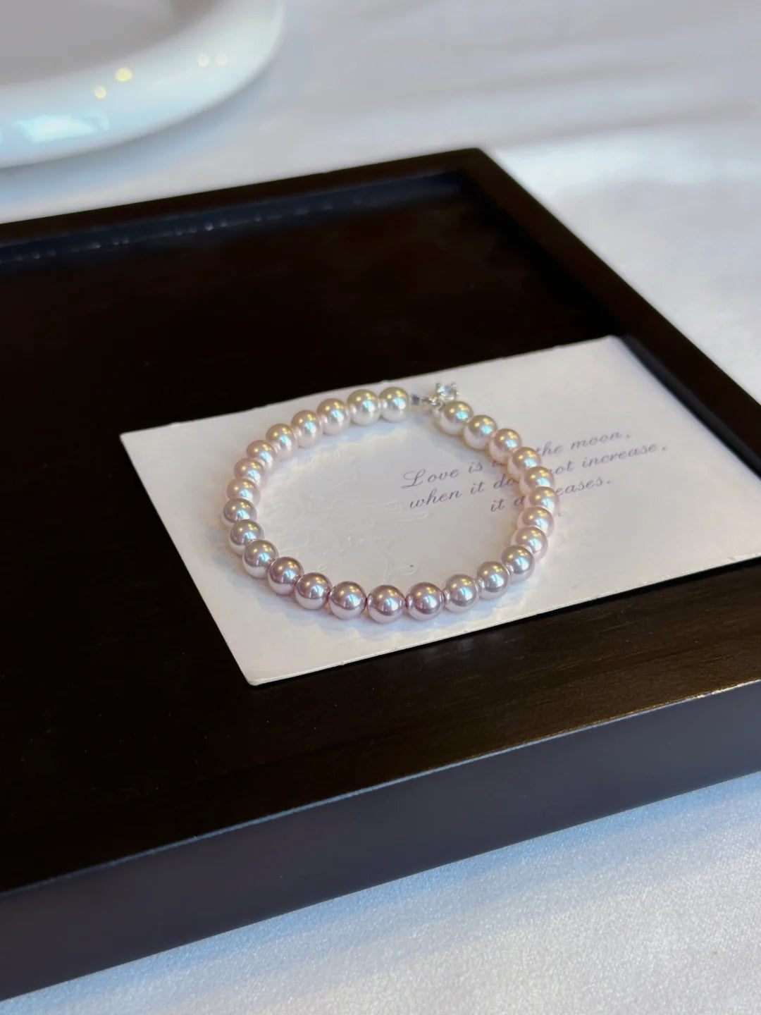 Close-up of classic strand high-lustre freshwater pearl bracelet for bridal styling