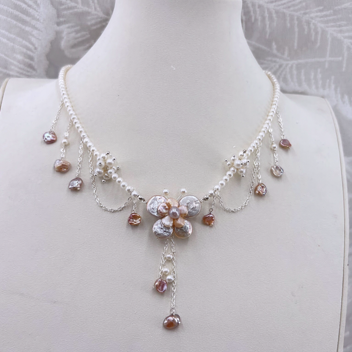 Front view of Rosé Baroque Pearl Garden Necklace, a natural freshwater baroque pearl necklace for garden weddings