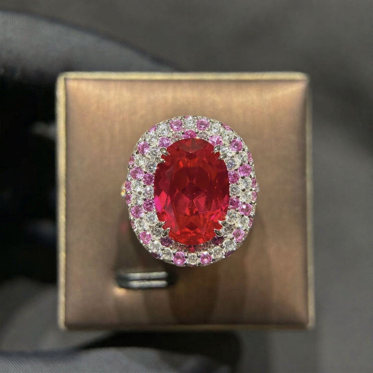 Front view of large oval lab-grown ruby double halo ring for luxury gifts