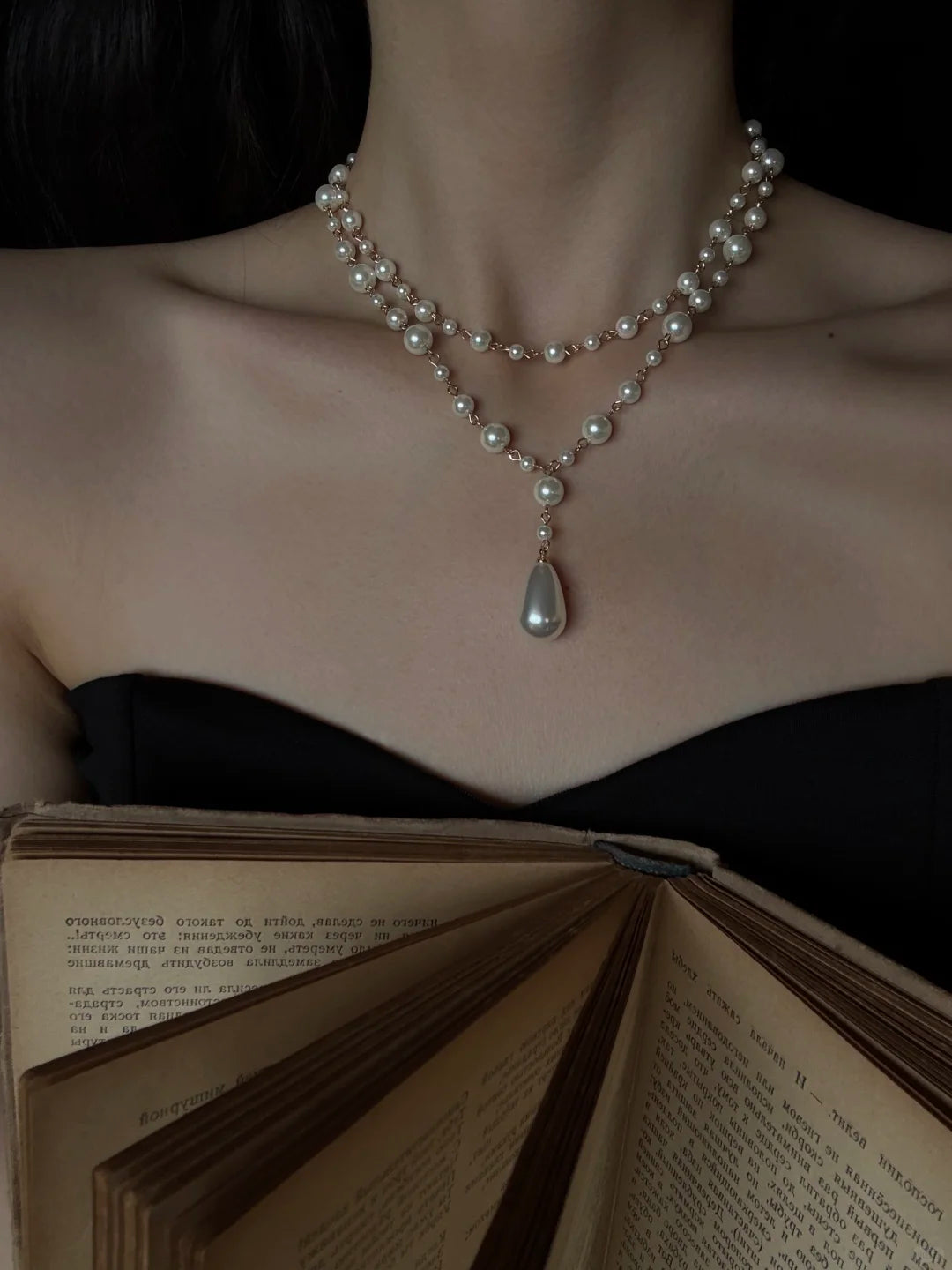 Detail view of layered y high-lustre freshwater pearl necklace for weddings
