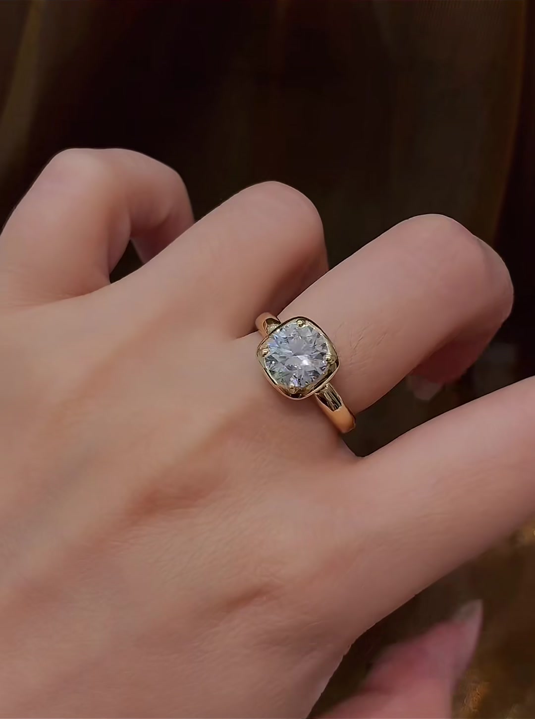 Close-up of lab-grown diamond cushion bezel engagement ring for modern proposals