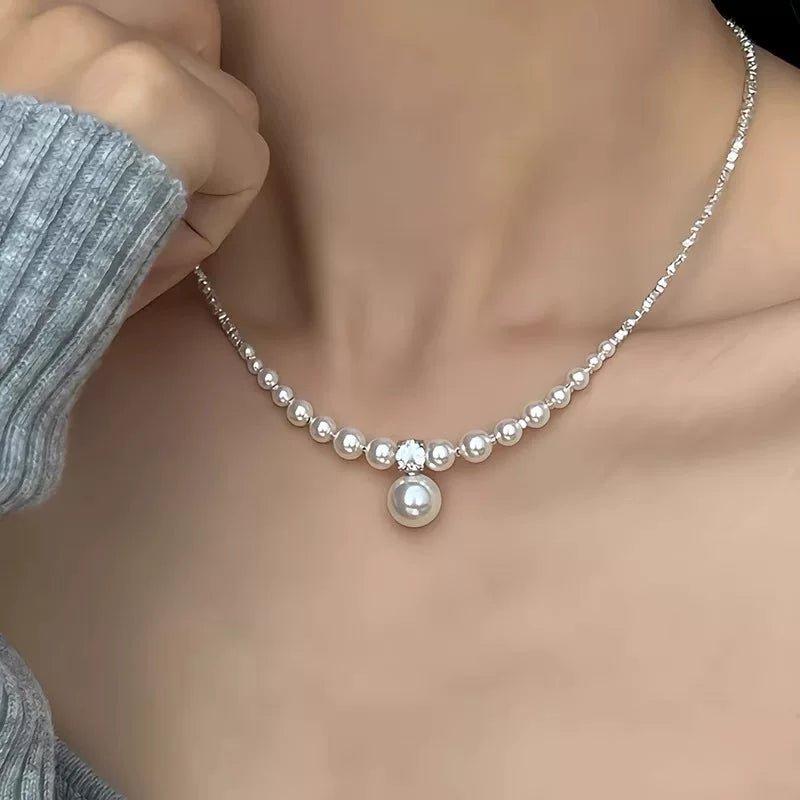 Pearl necklace being worn on a mannequin