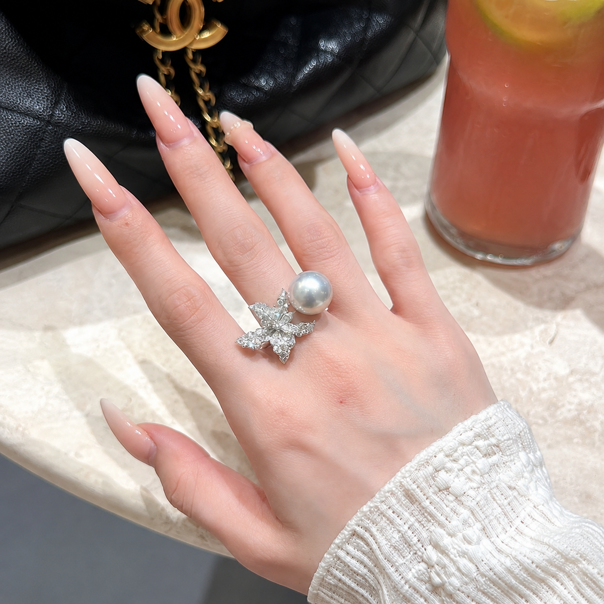 Luxury Akoya pearl statement ring with clear stone bow accents