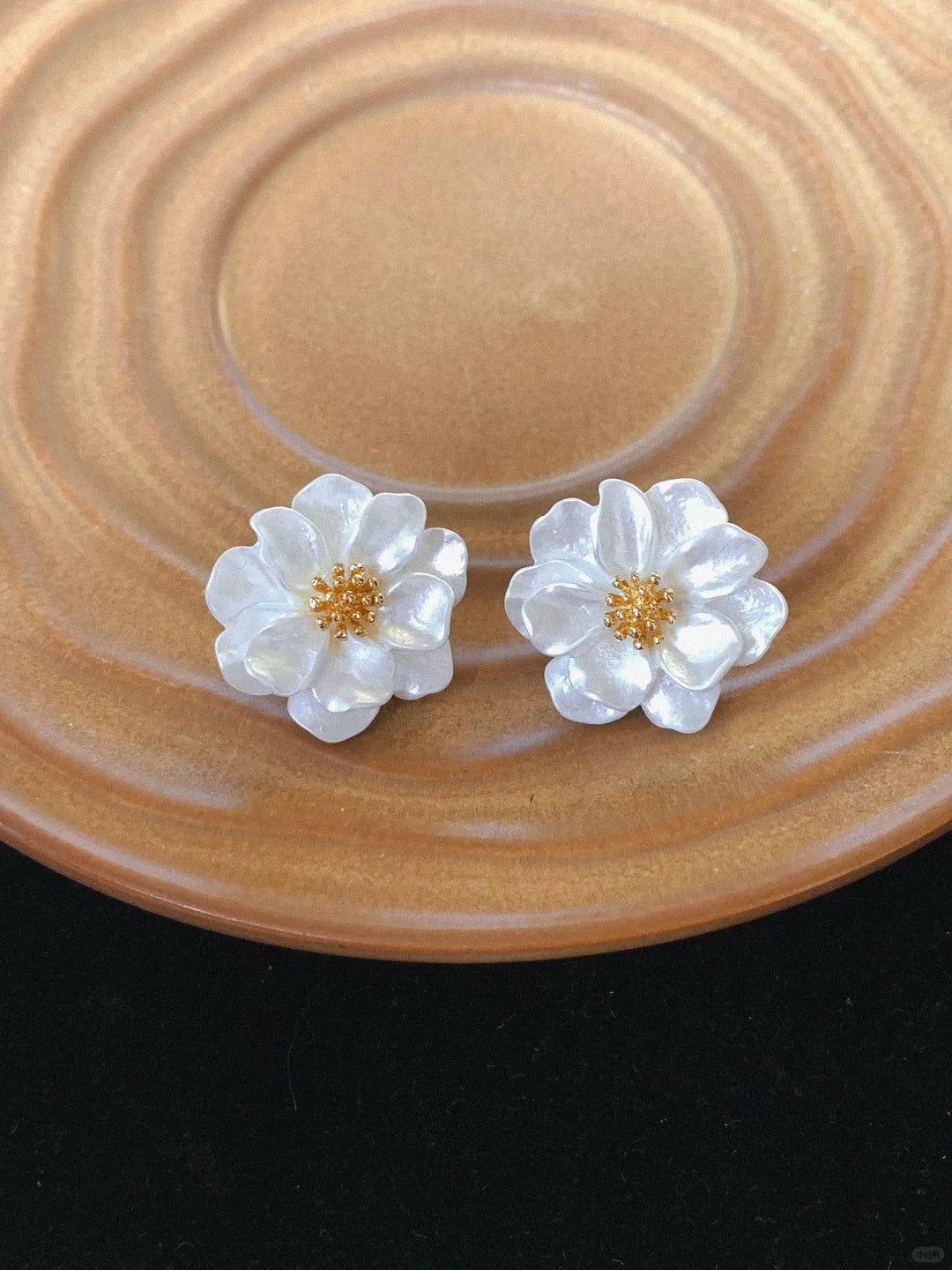 Front view of white flower stud high-lustre freshwater pearl earrings for wedding guest looks