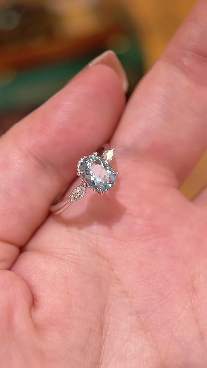 Styled view of lab-grown aquamarine oval engagement ring for spring proposals