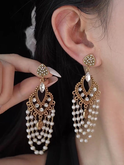 Front view of chandelier high-lustre freshwater pearl earrings for wedding guest looks