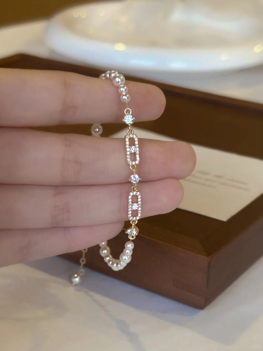Styled view of link detail high-lustre freshwater pearl bracelet for bridal styling