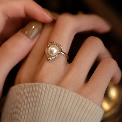 8mm freshwater pearl and 14K gold ring worn on the hand