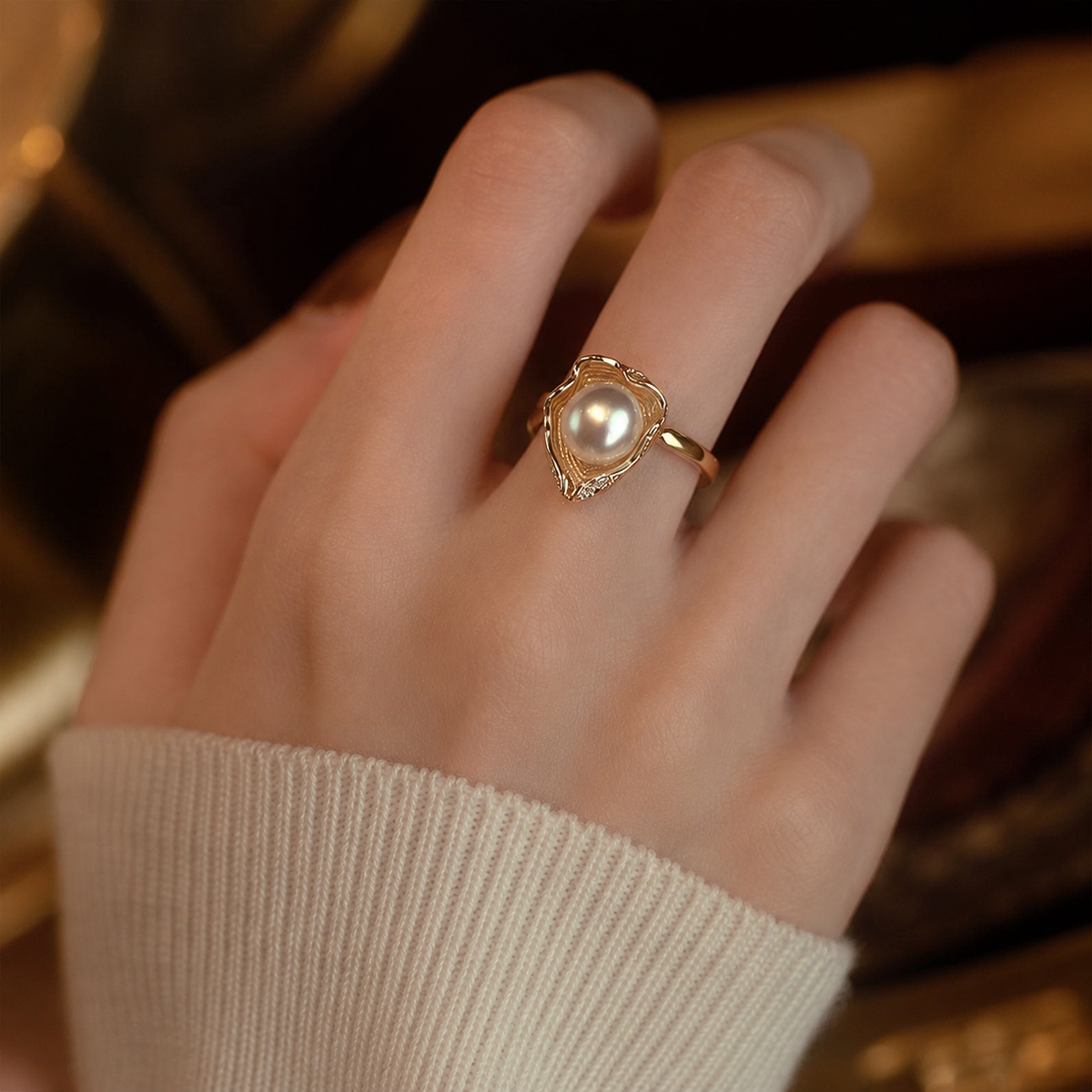 Close-up of an organic 14K gold setting around a freshwater pearl