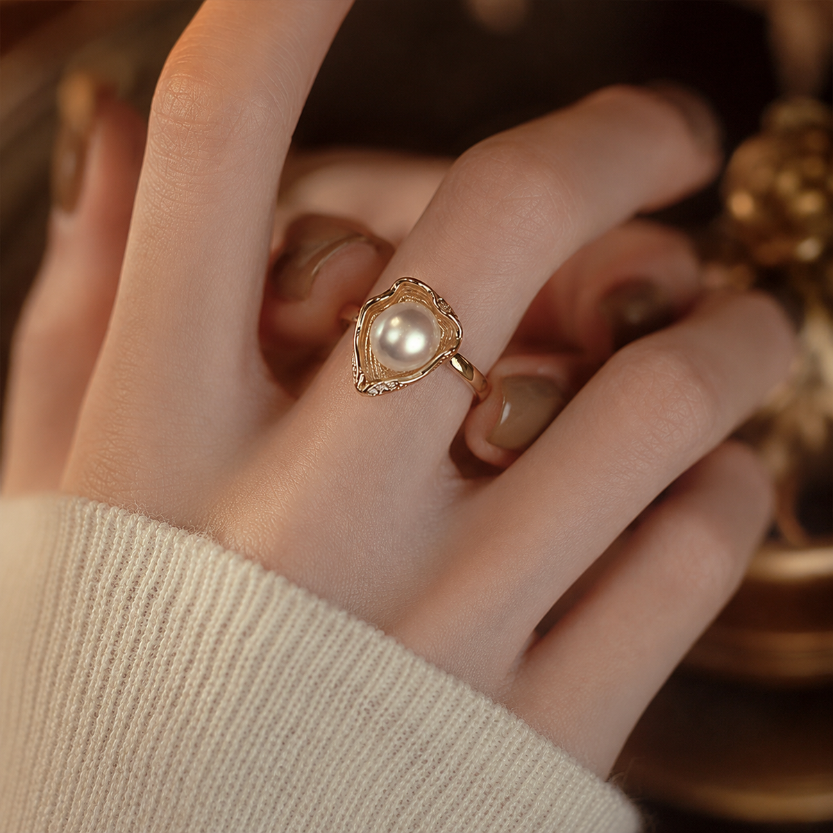 Sculptural freshwater pearl ring styled with a cream knit
