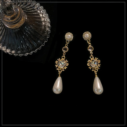 Front view of long drop high-lustre freshwater pearl earrings for wedding guest looks