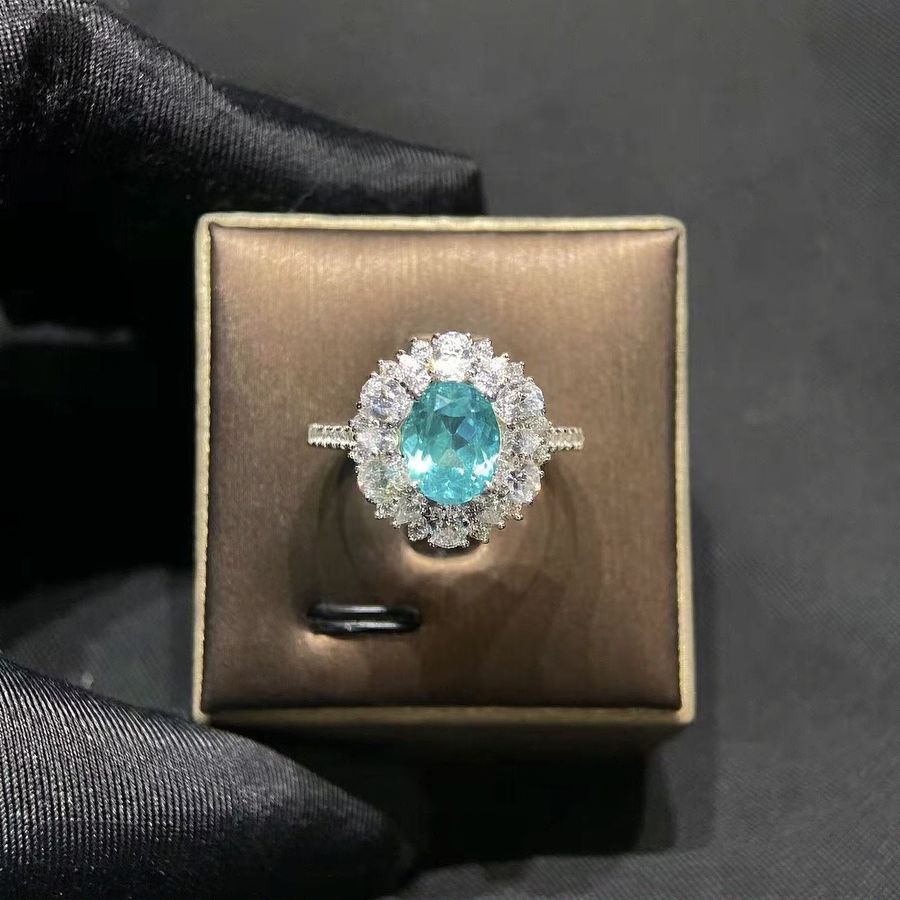 Front view of oval lab-grown Paraiba sapphire halo ring for proposals
