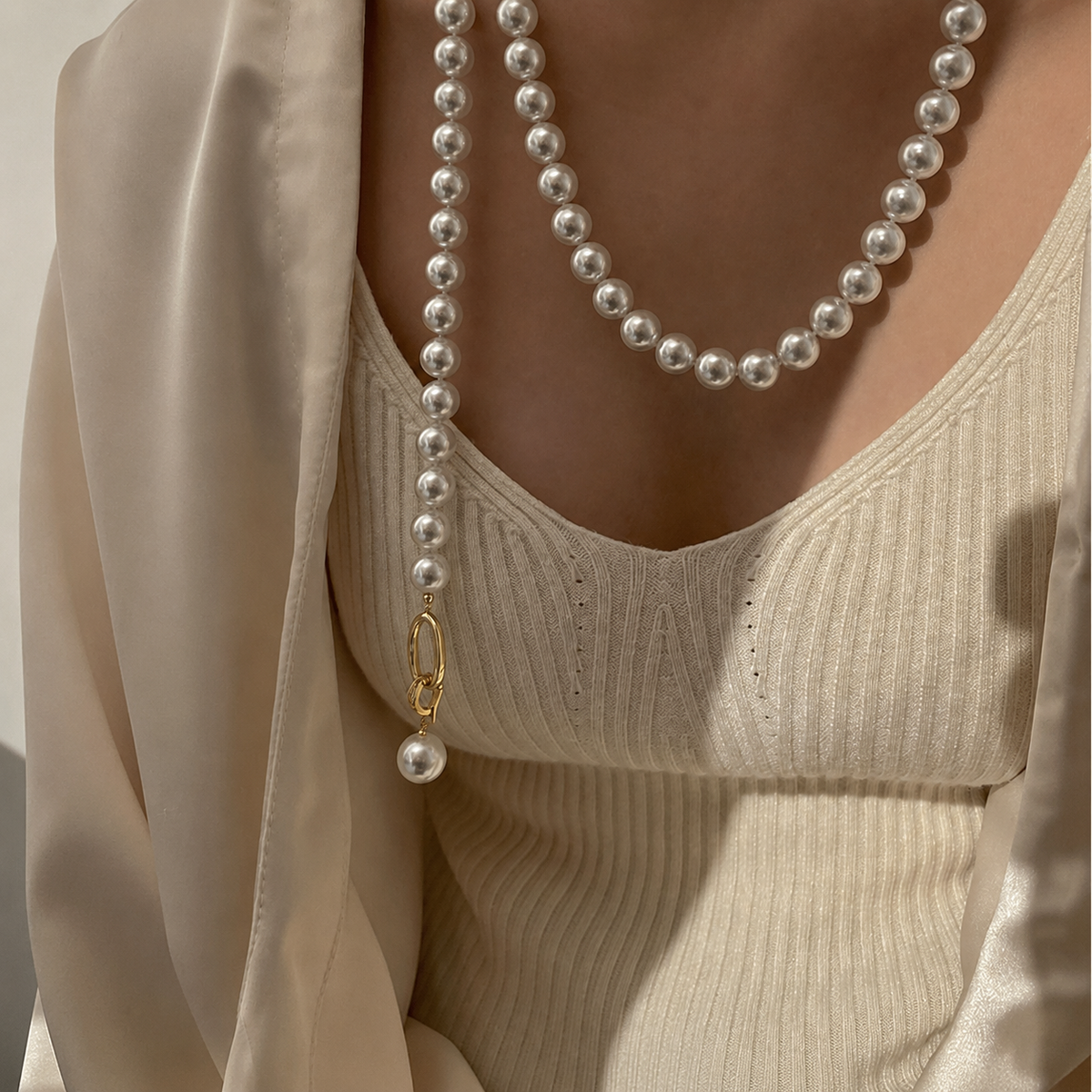 Aurora Akoya pearl necklace styled with an elegant cream outfit