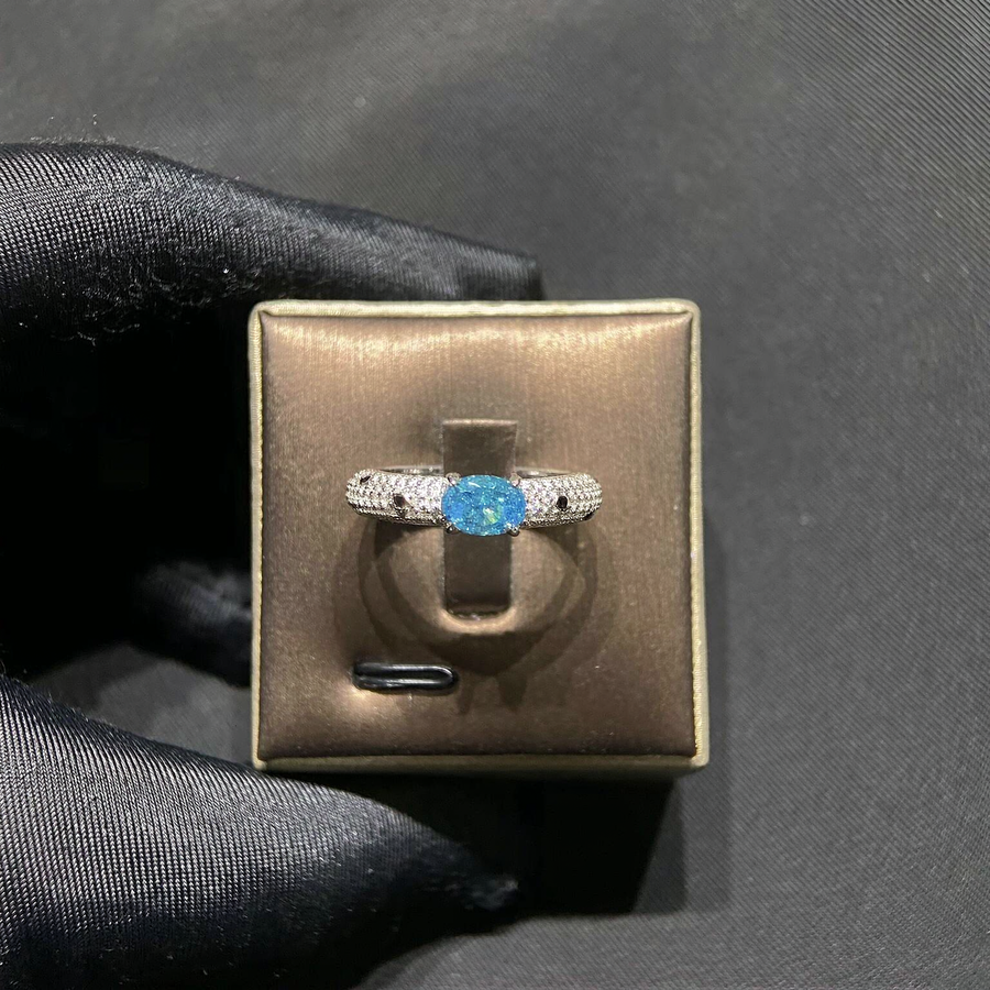 Front view of delicate lab-grown aquamarine solitaire ring for minimalist proposals