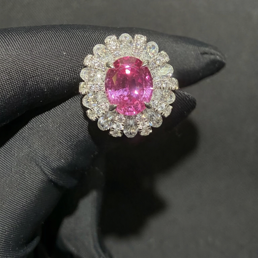 Front view of oval lab-grown Padparadscha floral halo ring for romantic proposals