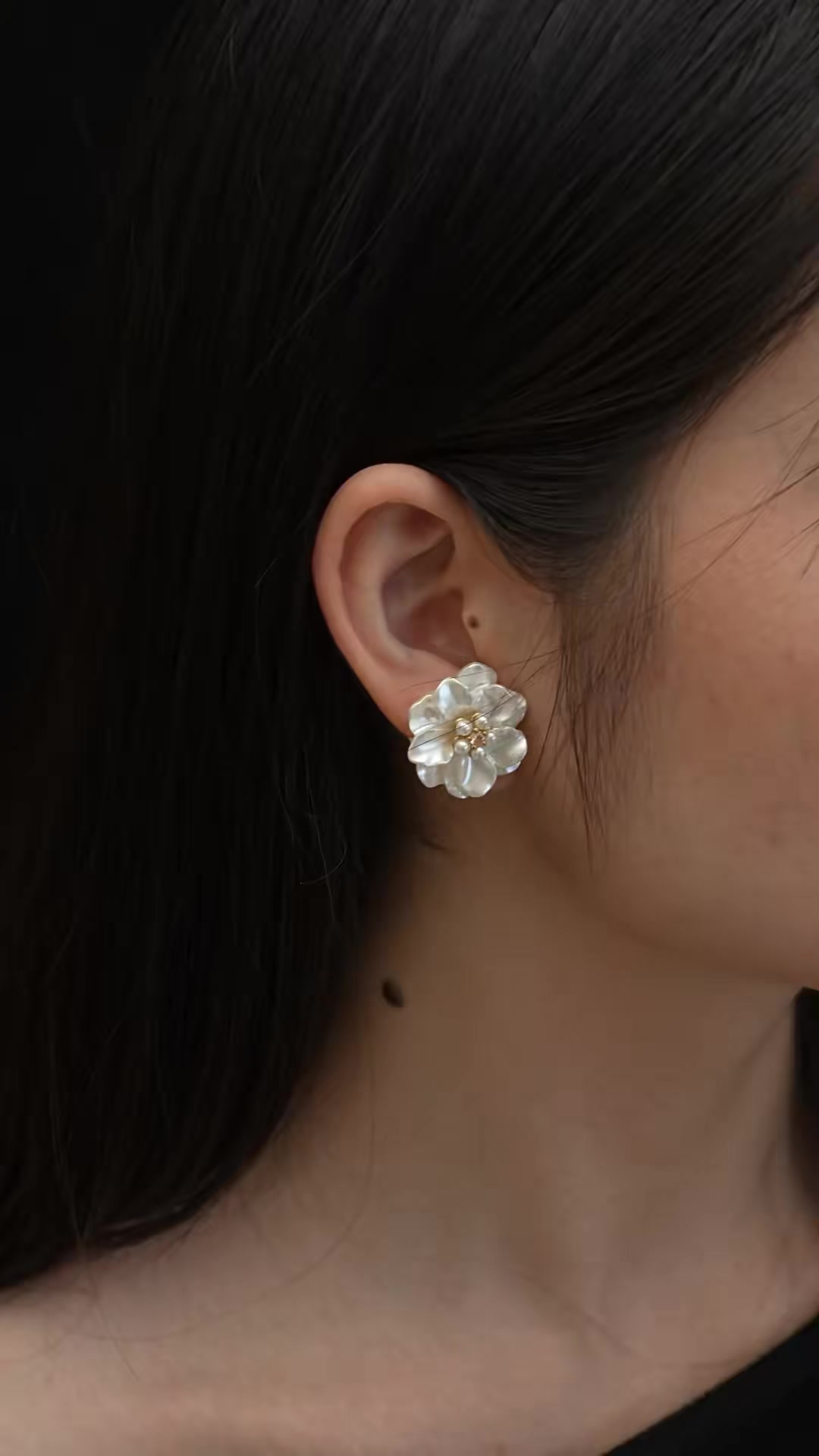 Styled view of white flower high-lustre freshwater pearl earrings for wedding guest looks