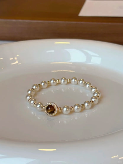 Front view of dark medallion high-lustre freshwater pearl bracelet for bridal styling