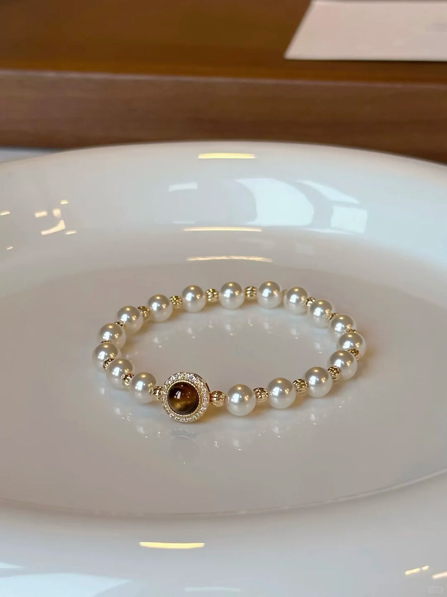 Front view of dark medallion high-lustre freshwater pearl bracelet for bridal styling