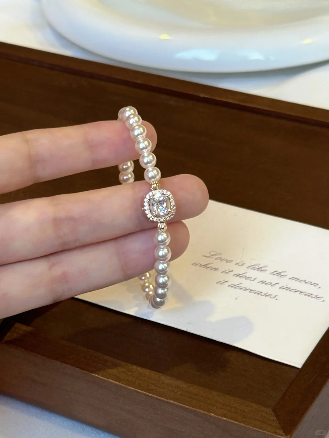 Close-up of oval cameo high-lustre freshwater pearl bracelet for bridal styling