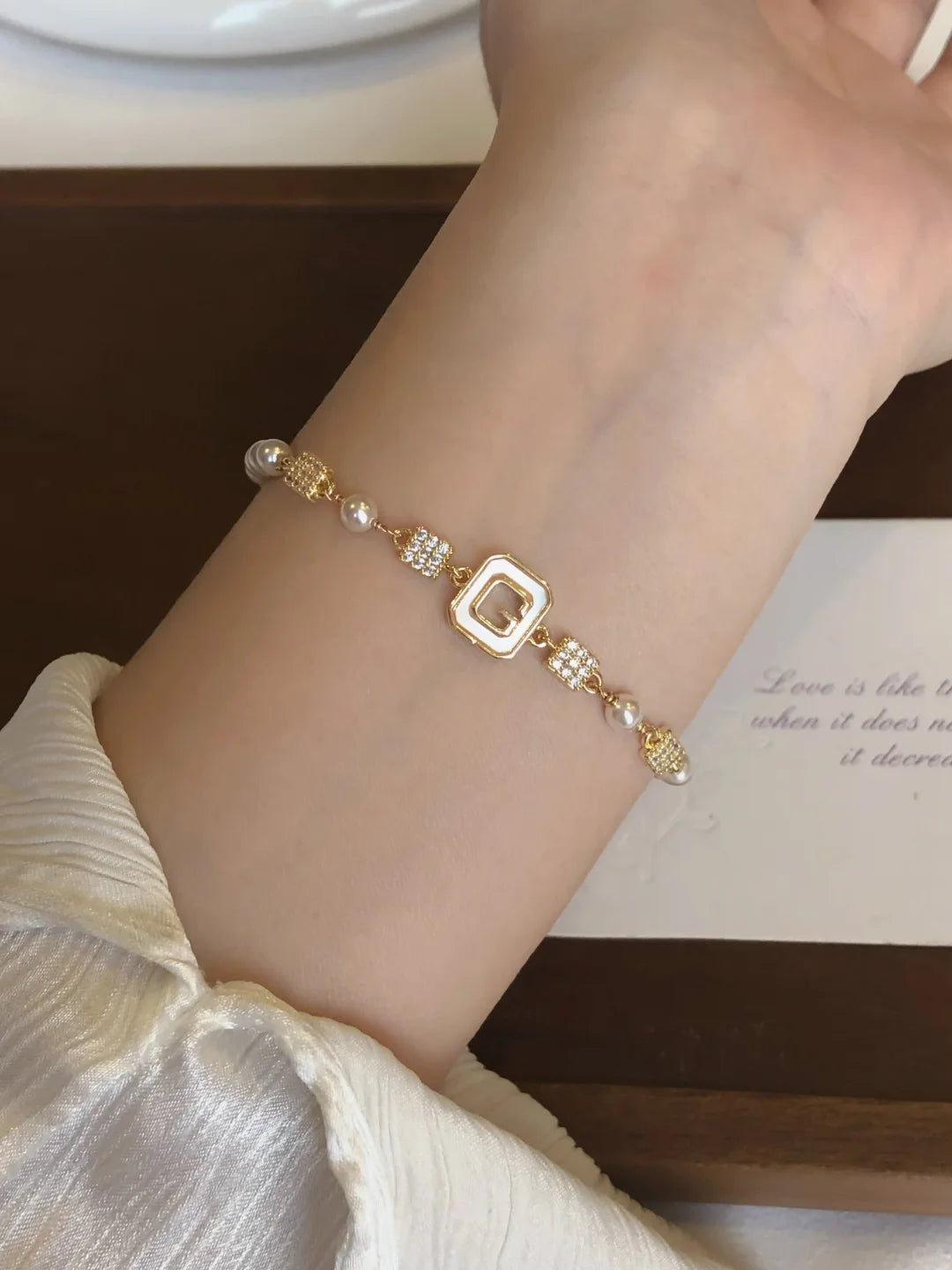 Close-up of geometric station high-lustre freshwater pearl bracelet for bridal styling