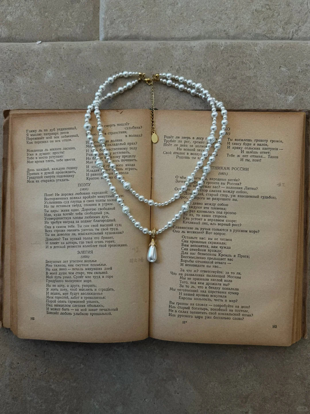 Front view of layered drop high-lustre freshwater pearl necklace for weddings