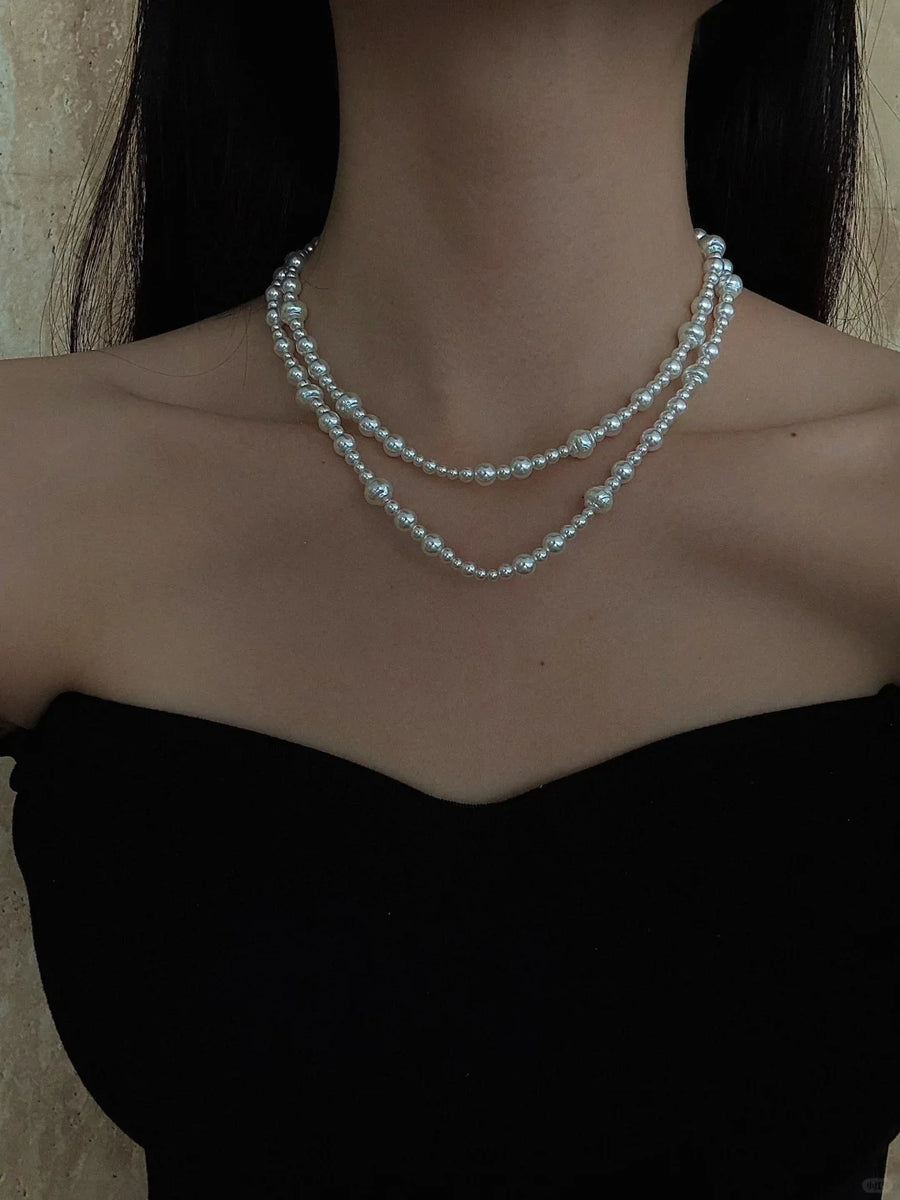 Styled view of layered drop high-lustre freshwater pearl necklace for weddings