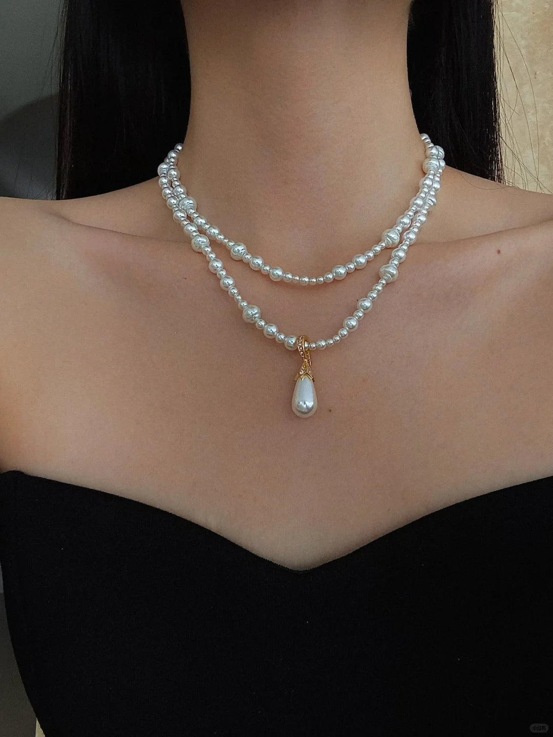 Detail view of layered drop high-lustre freshwater pearl necklace for weddings