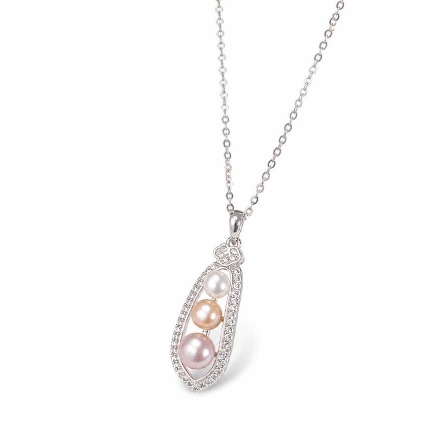 Celeste 6mm Akoya pearl trio pendant necklace on a white background
