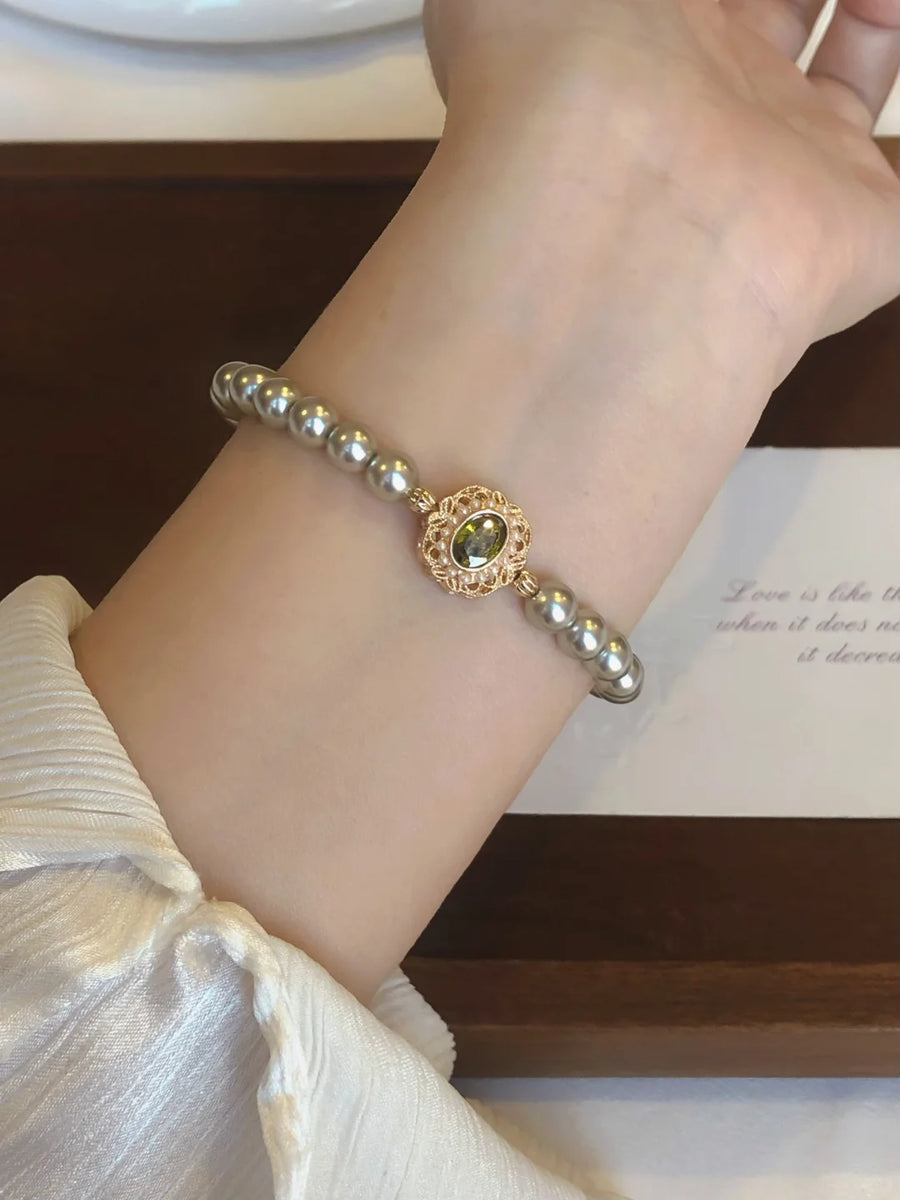 Styled view of circle motif high-lustre freshwater pearl bracelet for bridal styling
