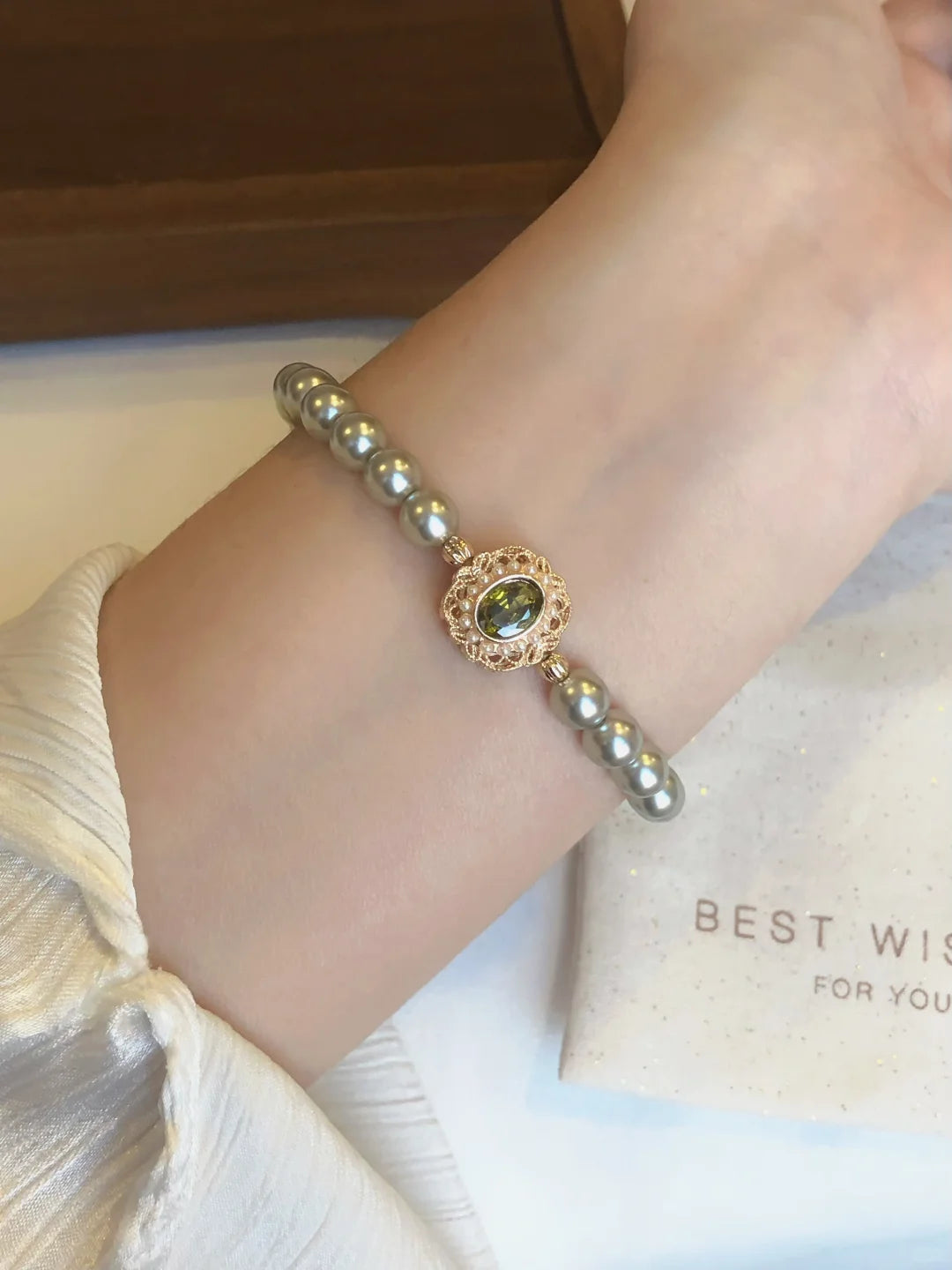 Close-up of circle motif high-lustre freshwater pearl bracelet for bridal styling