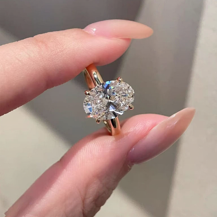 Front view of round lab-grown diamond three-stone engagement ring for engagement proposals