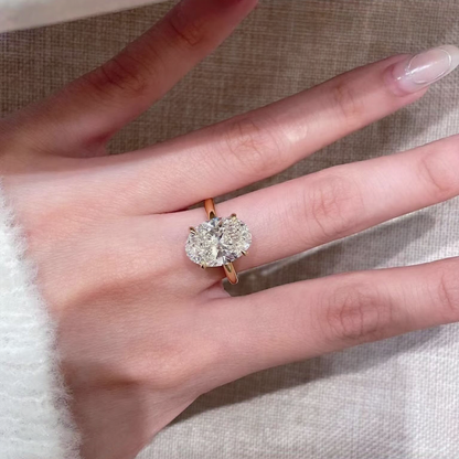 Styled view of round lab-grown diamond three-stone engagement ring for engagement proposals