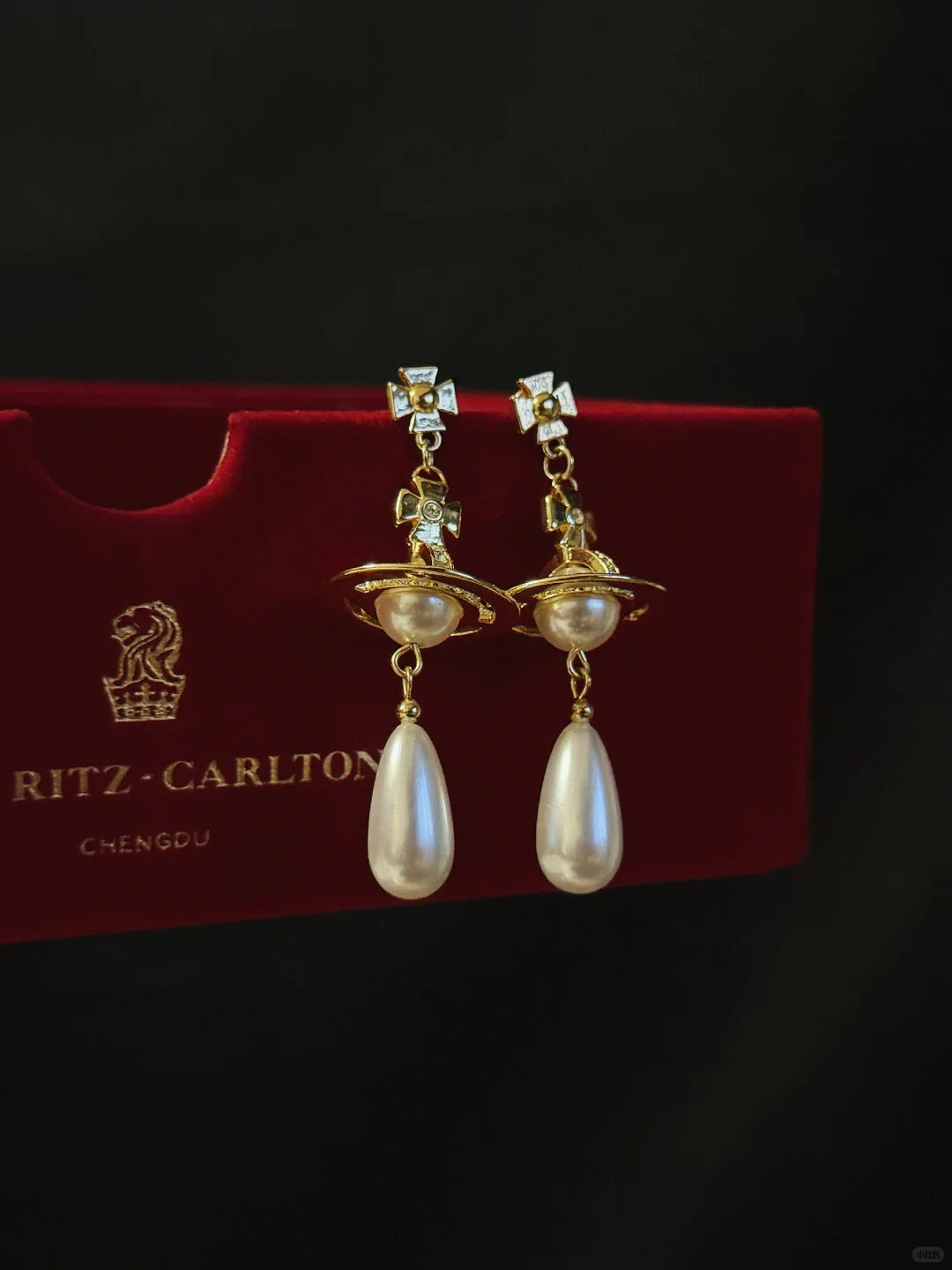 Front view of orb drop high-lustre freshwater pearl earrings for wedding guest looks