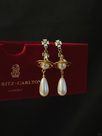 Front view of orb drop high-lustre freshwater pearl earrings for wedding guest looks