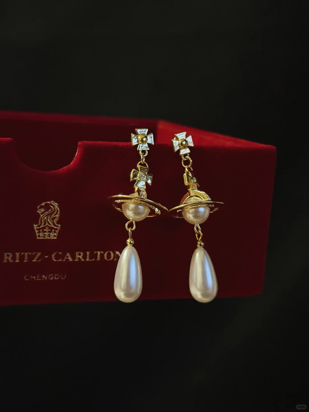 Close-up of orb drop high-lustre freshwater pearl earrings for wedding guest looks