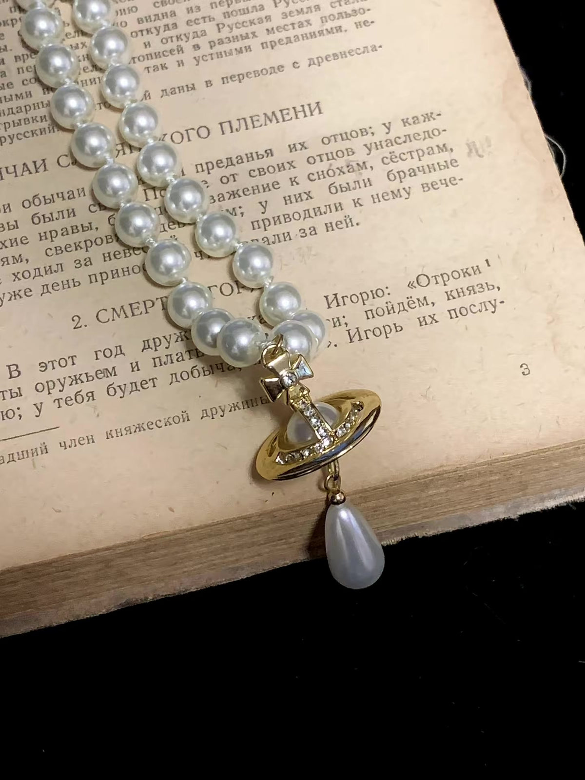 Styled view of orb motif high-lustre freshwater pearl necklace for weddings