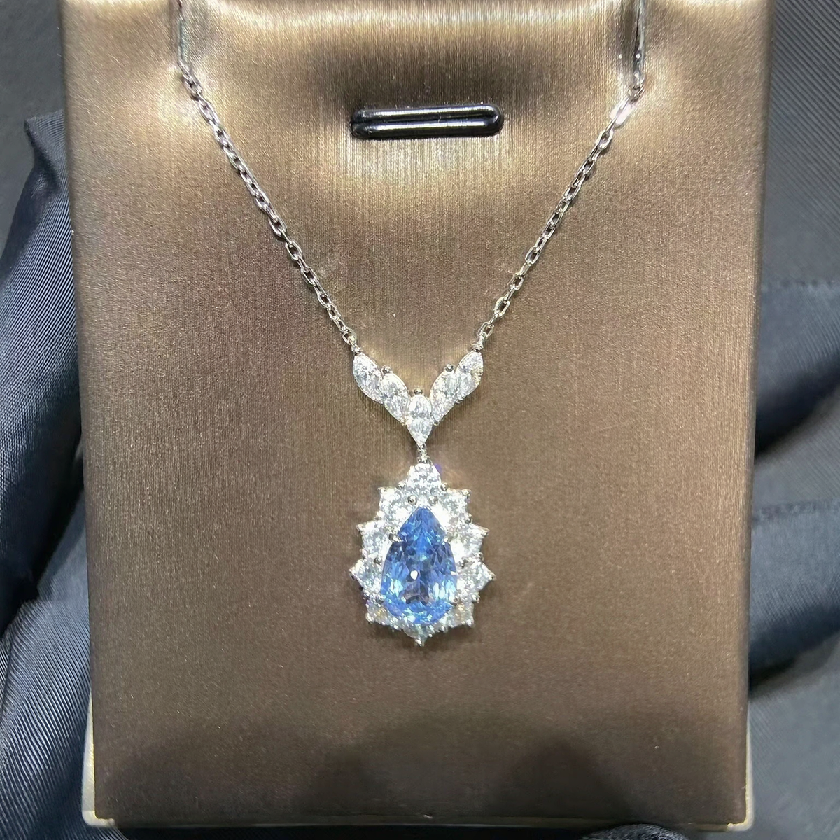 Front view of pear-cut lab-grown aquamarine drop pendant necklace for bridal gifts