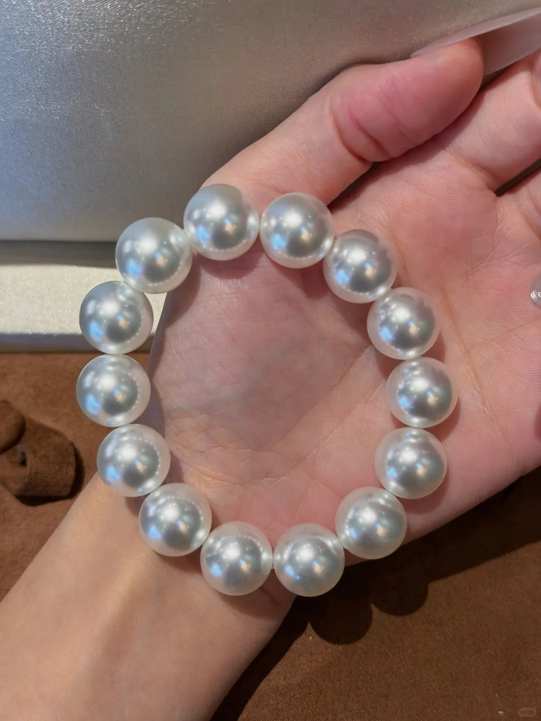 Styled view of classic strand high-lustre freshwater pearl bracelet for bridal styling