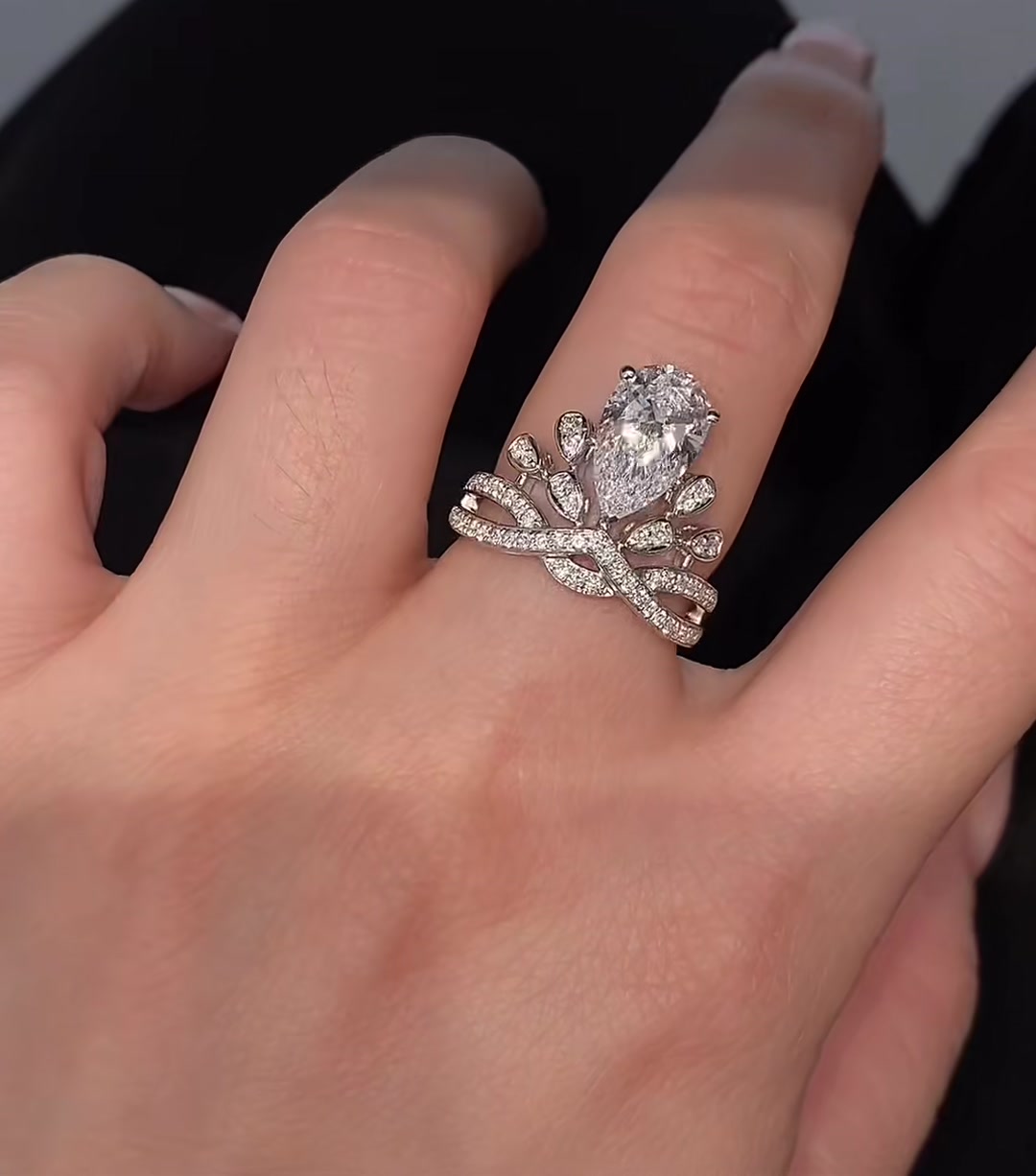 Close-up of lab-grown diamond pear crown engagement ring for fairytale proposals