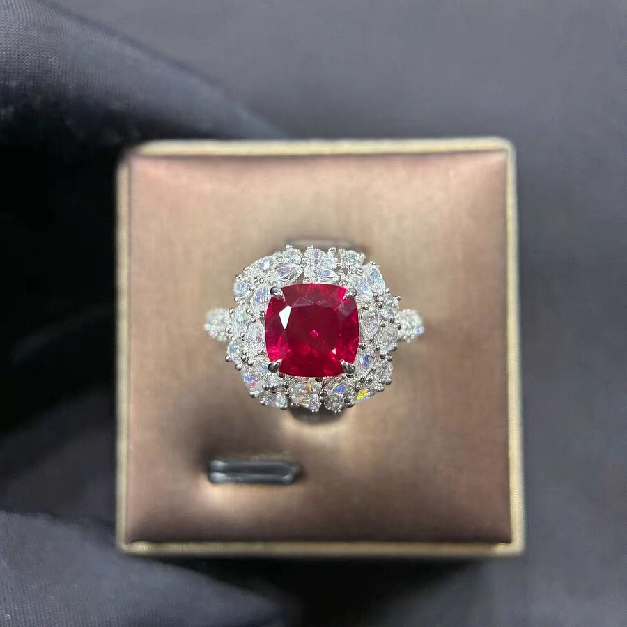 Front view of cushion-cut lab-grown ruby halo ring for romantic proposals
