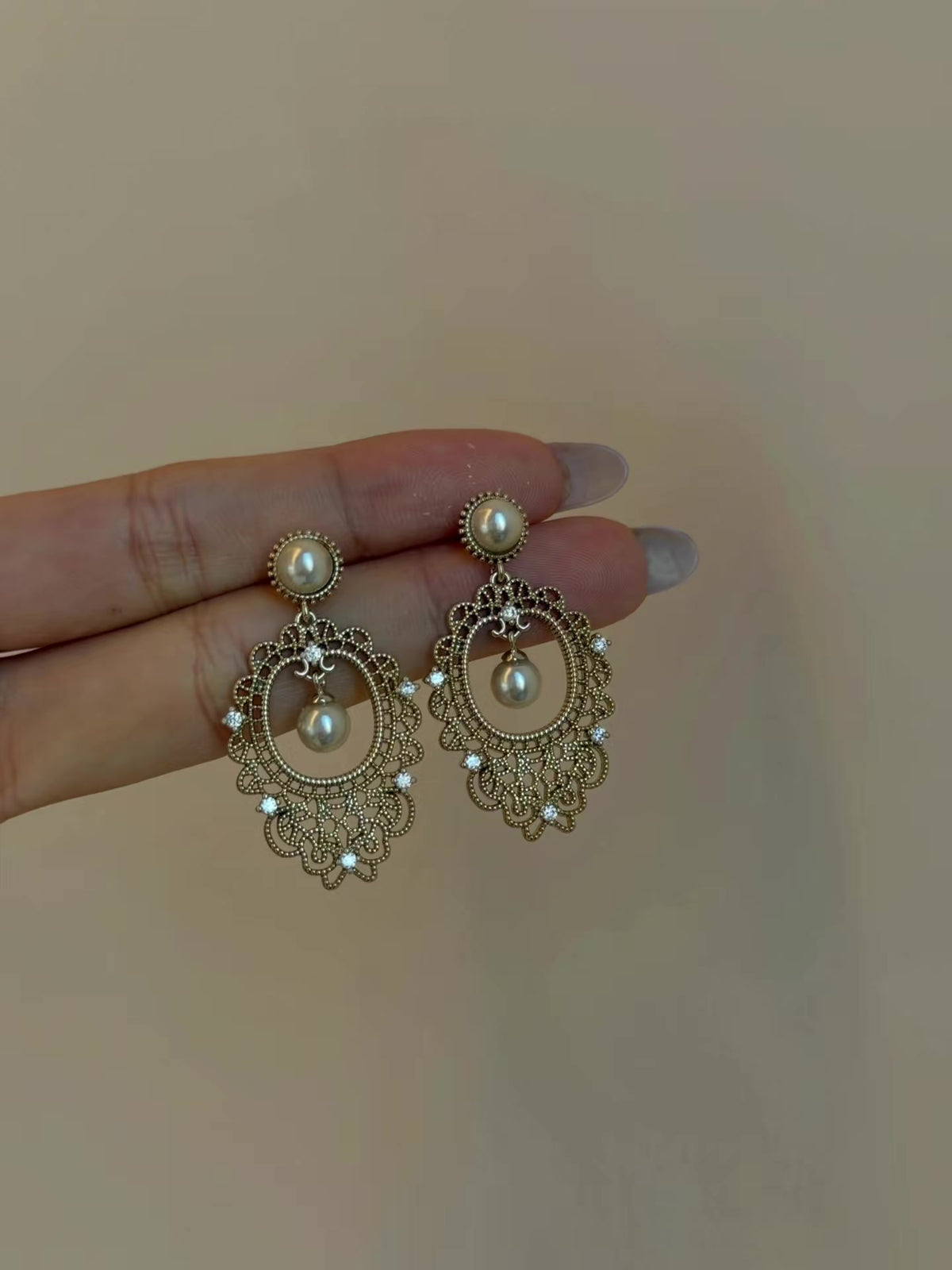Front view of vintage lace high-lustre freshwater pearl earrings for wedding guest looks
