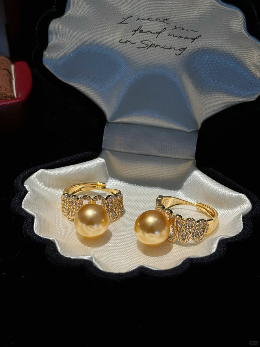 Styled view of golden stud high-lustre freshwater pearl earrings for wedding guest looks