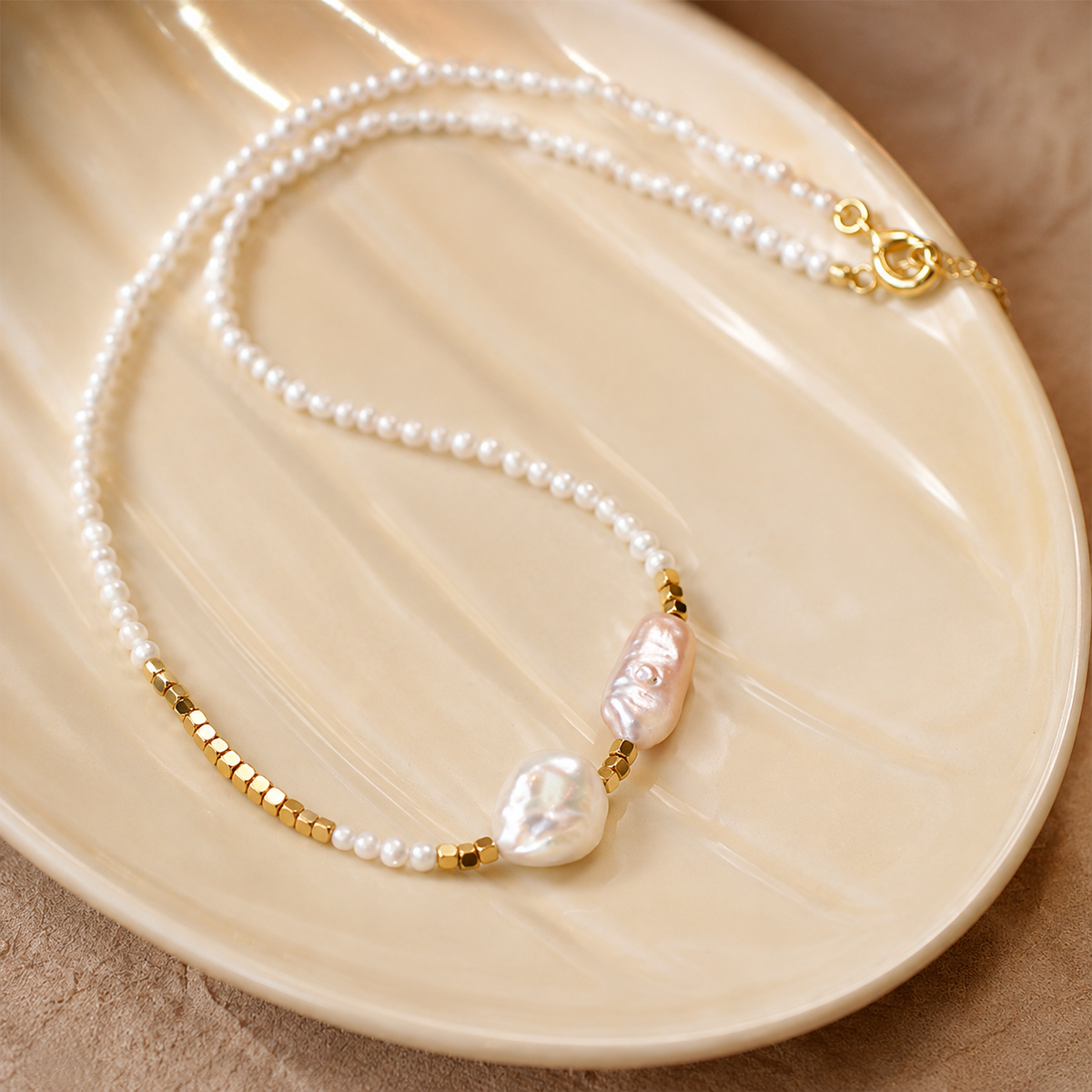 Detailed view of freshwater seed pearls, baroque pearls and gold beads