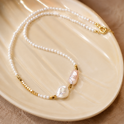 Detailed view of freshwater seed pearls, baroque pearls and gold beads